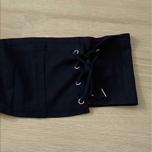 black fabric corset top